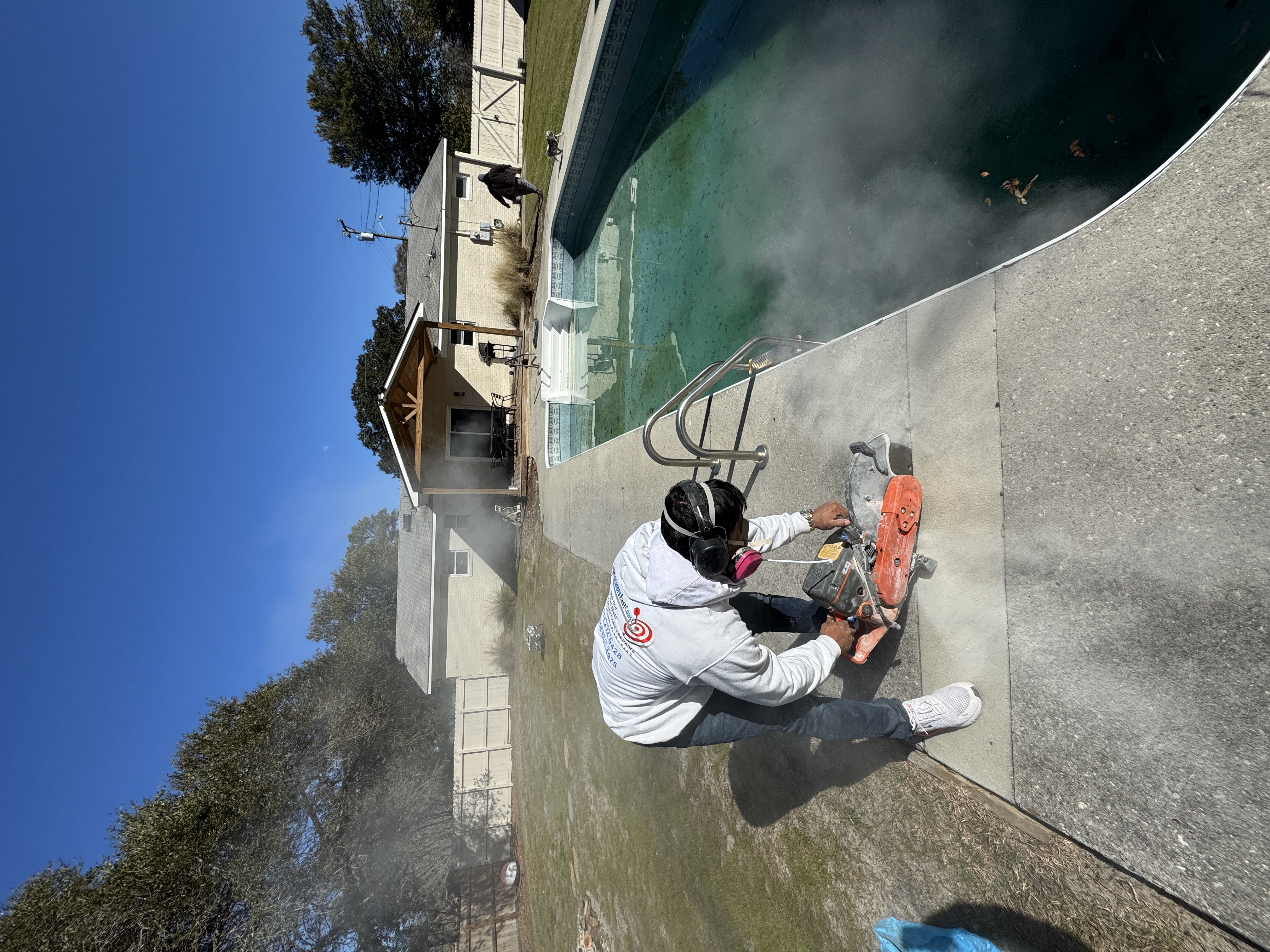 Concrete cutting around pool deck for broken line repair